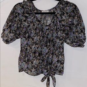 Delia’s black floral blouse